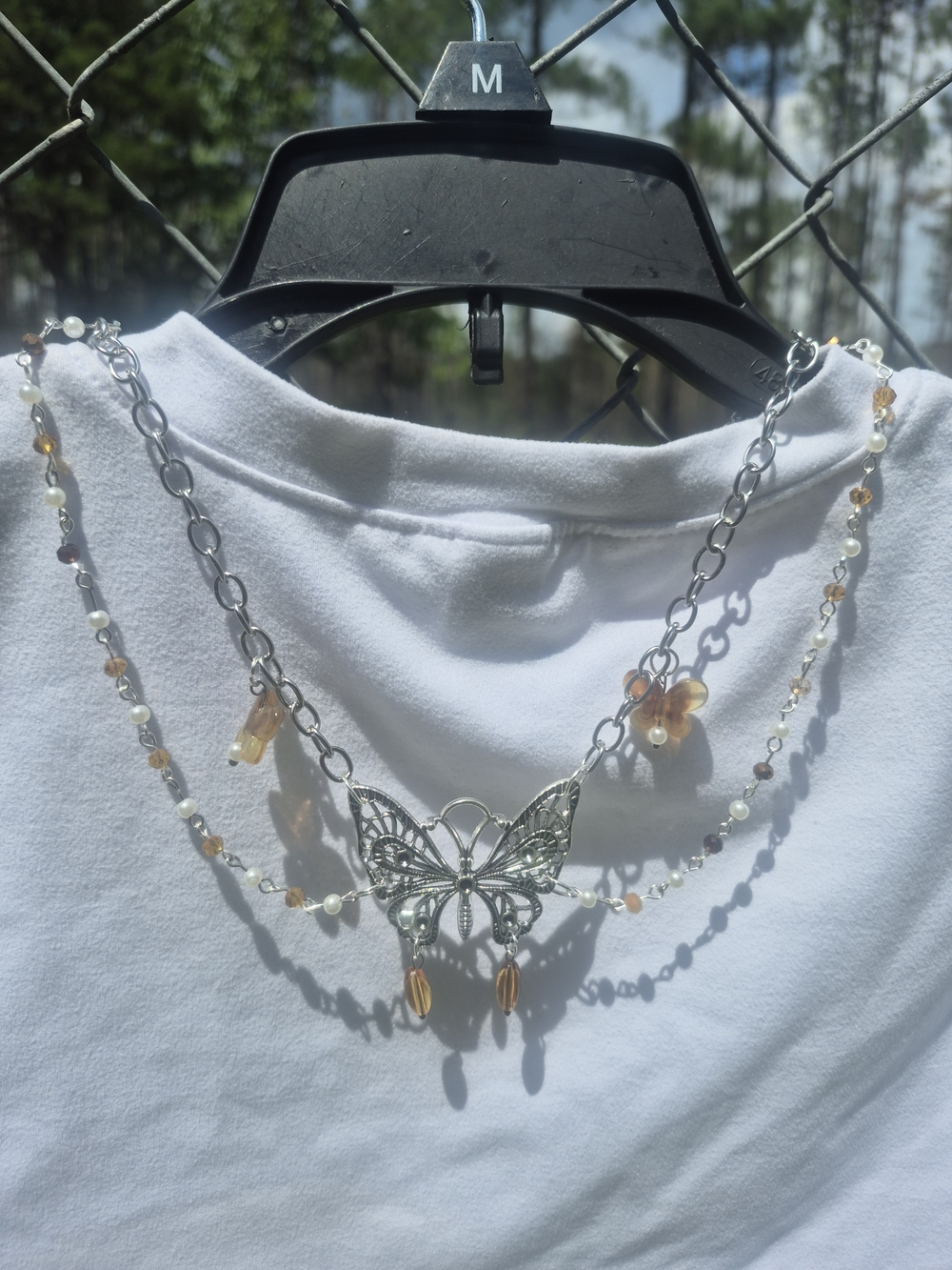 Layered Silver Butterfly Necklace with Amber and Pearl Accents